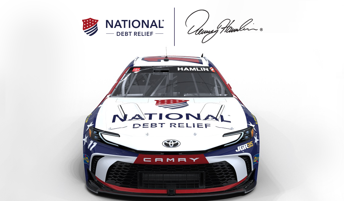 Front view of a National Debt Relief–branded NASCAR race car with red, white, and blue design elements.