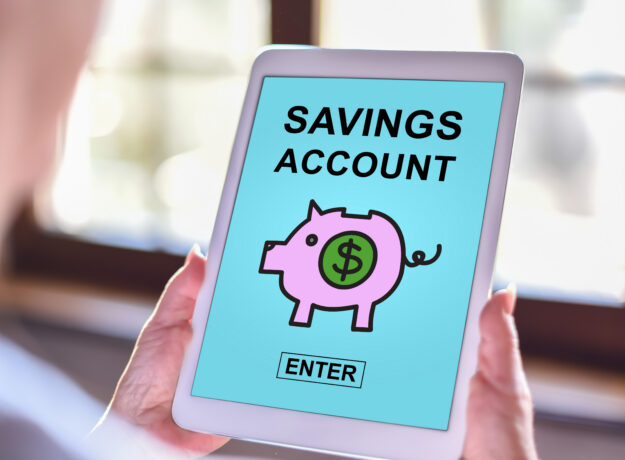Tablet screen displaying “Savings Account” with a piggy bank icon and enter button.