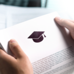 Hands holding a document with a graduation cap icon, representing student loan or education-related paperwork