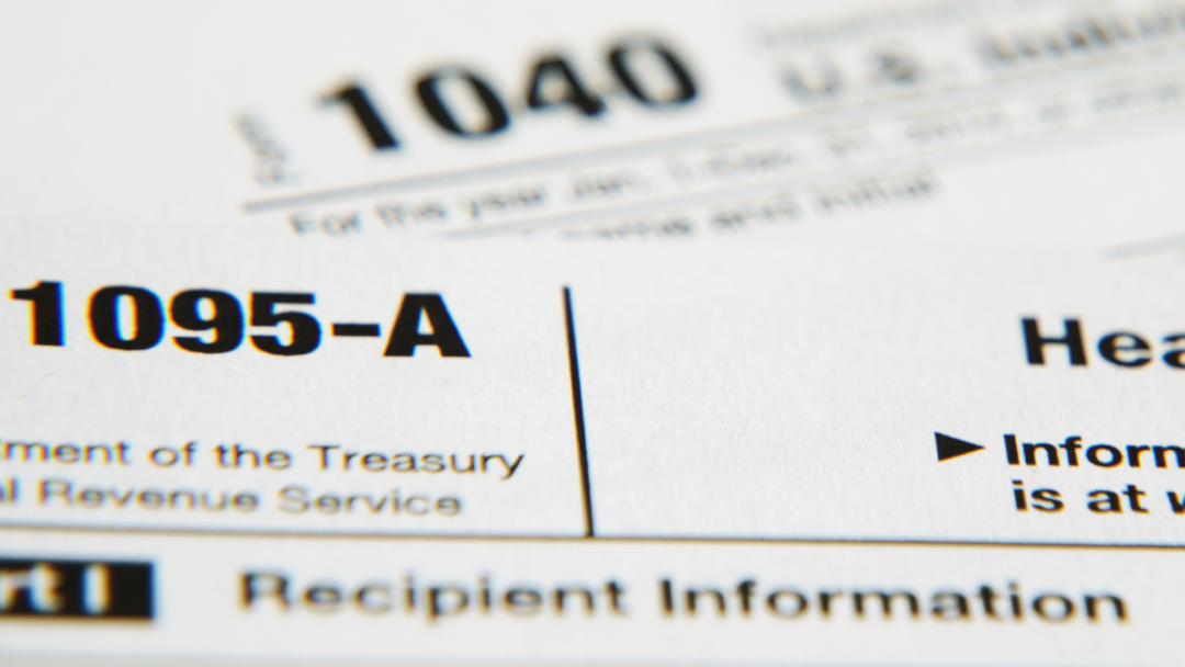 Close-up of IRS Form 1095-A with the title and tax form number visible.