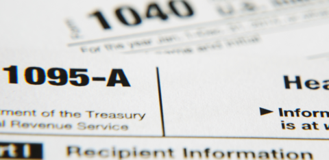 Close-up of IRS Form 1095-A with the title and tax form number visible.