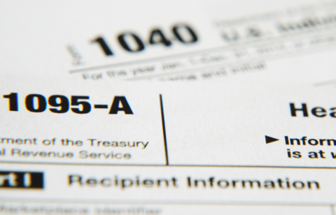 Close-up of IRS Form 1095-A with the title and tax form number visible.