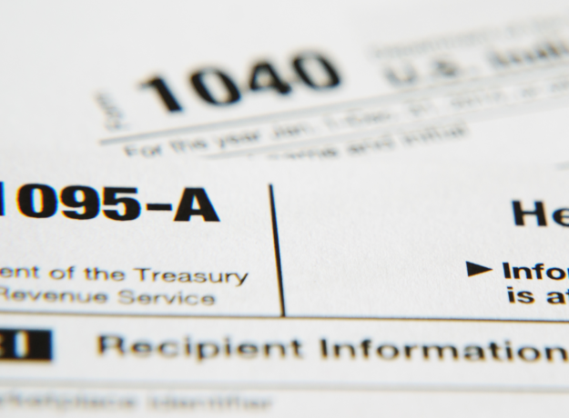Close-up of IRS Form 1095-A with the title and tax form number visible.