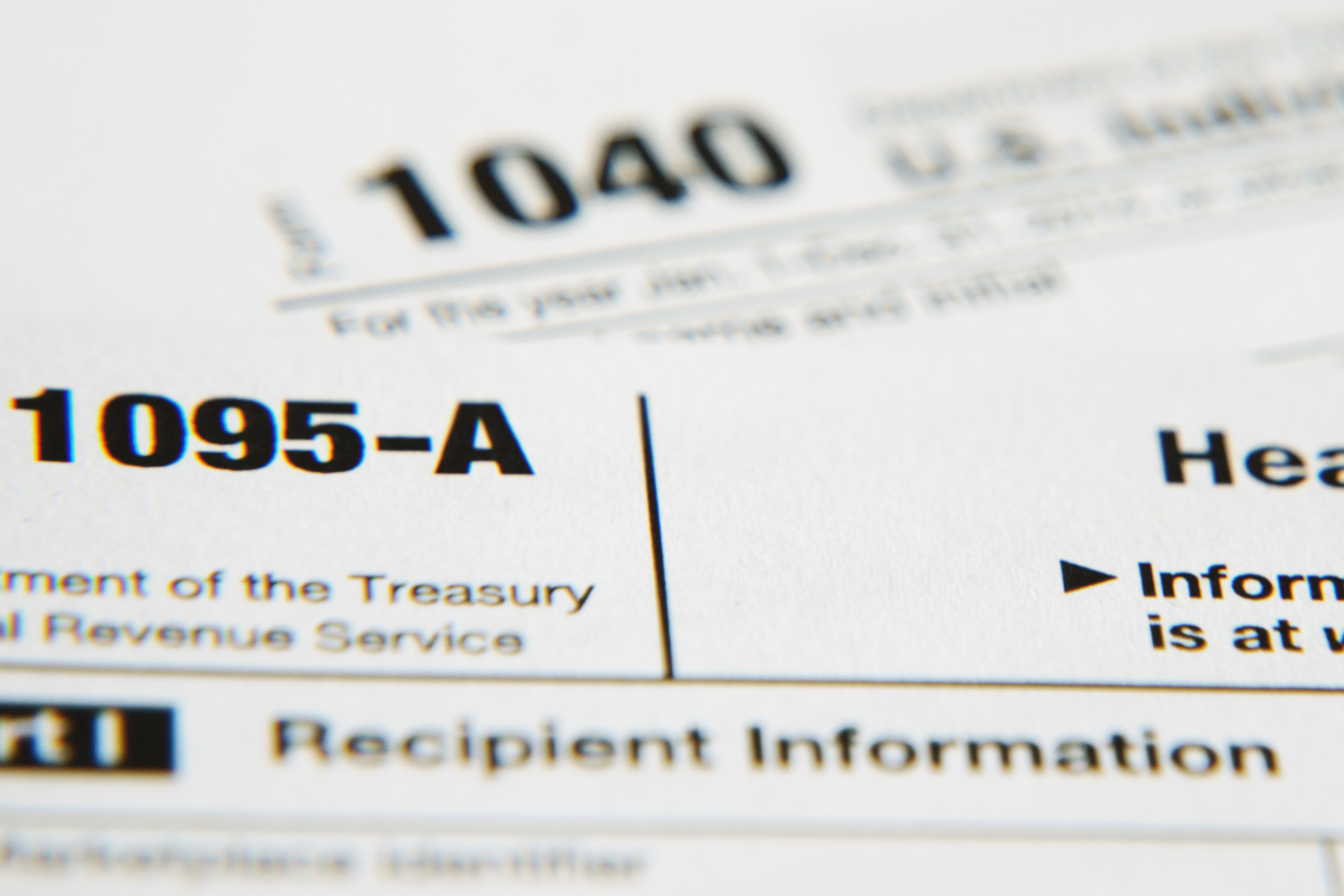 Close-up of IRS Form 1095-A with the title and tax form number visible.