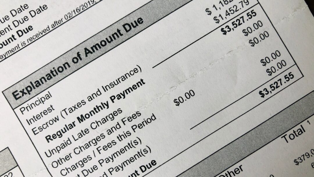 Close-up of a billing statement showing an itemized breakdown and total amount due.