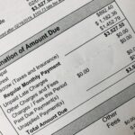 Close-up of a billing statement showing an itemized breakdown and total amount due.