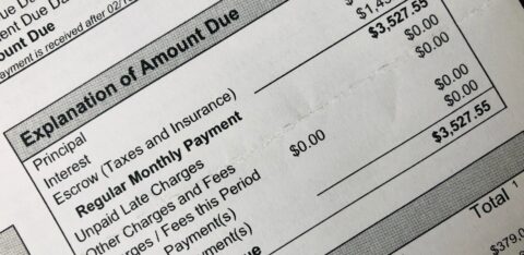 Close-up of a billing statement showing an itemized breakdown and total amount due.