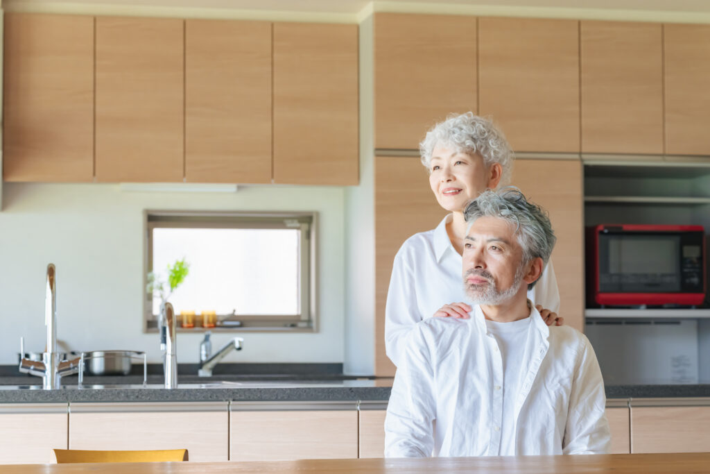 two older adults in a kitchen