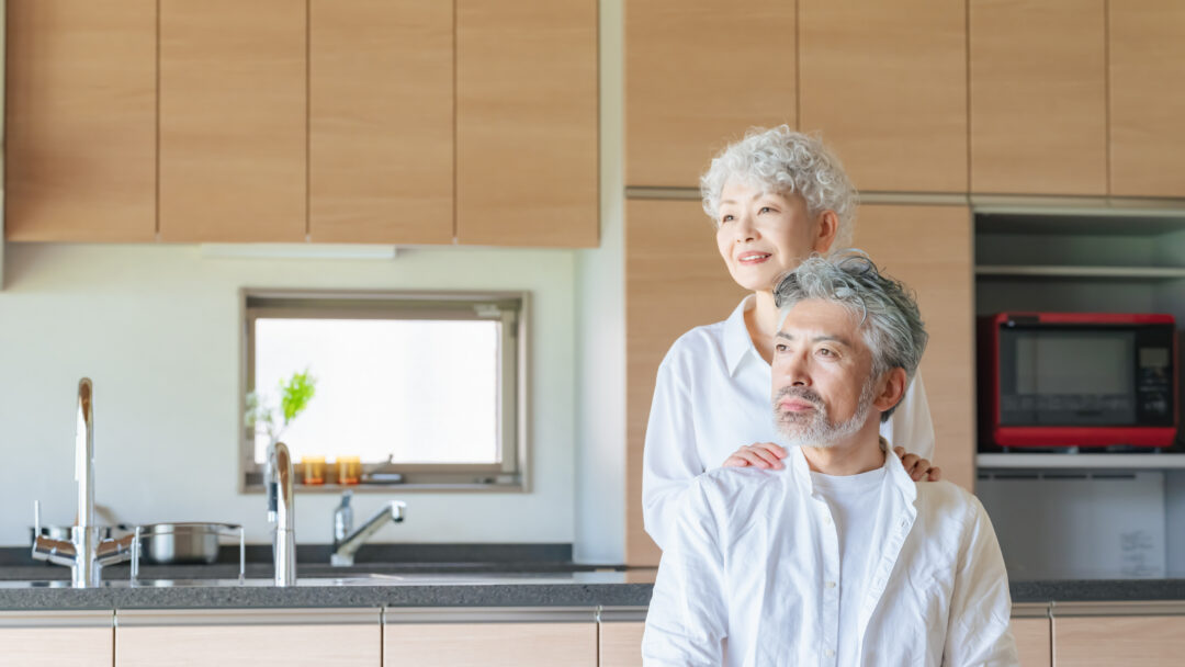 two older adults in a kitchen