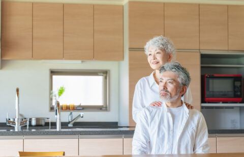 two older adults in a kitchen