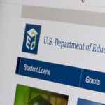 Close-up of the U.S. Department of Education website showing navigation for student loans and grants