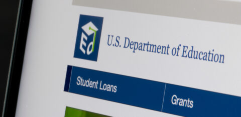 Close-up of the U.S. Department of Education website showing navigation for student loans and grants