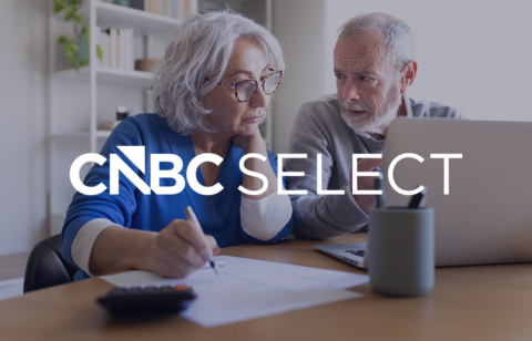 Older couple reviewing finances on a laptop with the CNBC Select logo overlaid on the image.