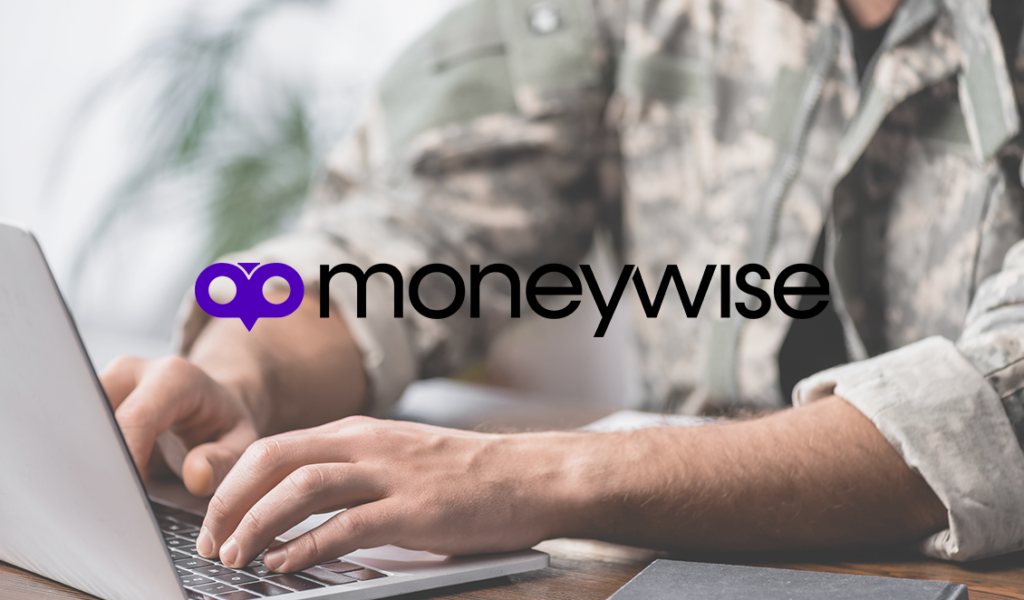 Person in military uniform typing on a laptop at a desk with the Moneywise logo displayed prominently in the center.
