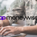 Person in military uniform typing on a laptop at a desk with the Moneywise logo displayed prominently in the center.
