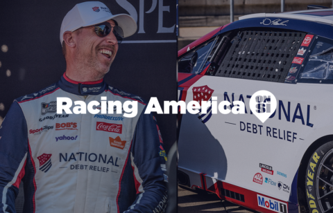 Denny Hamlin smiling in a National Debt Relief racing suit beside his No. 11 car, with “Racing America on SI” text overlay across the image.