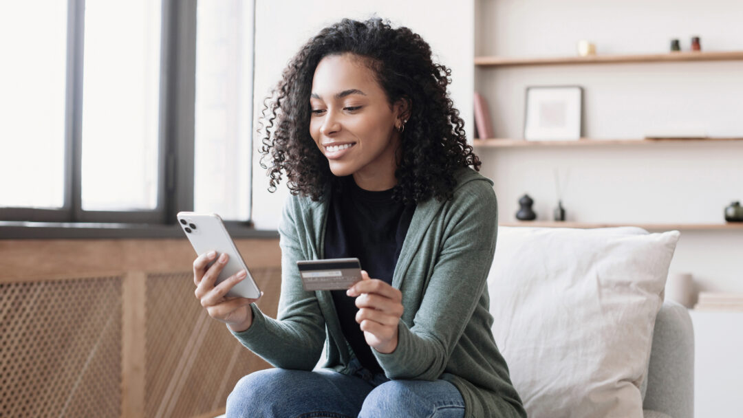 Woman holding credit card and using smartphone at home, businesswoman shopping online, e commerce, internet banking, spending money, working from home concept