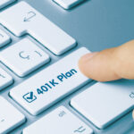 finger pressing a button on a computer that says 401k plan