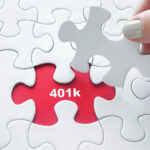 Hand placing jigsaw puzzle with 401k text