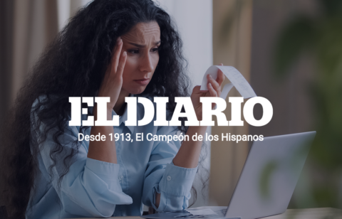Person reviewing credit card statements and household finances while managing rising debt costs.