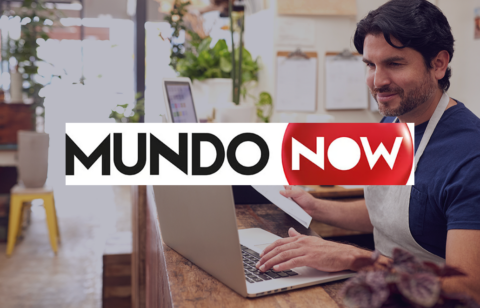 Man working on a laptop with the MundoNow logo overlaid on the image.