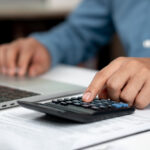 Modern business accounting management: Using technology for efficient tax calculations, accounting, assets, balance sheets, stock market statistics, and annual tax laws to protect businesses.