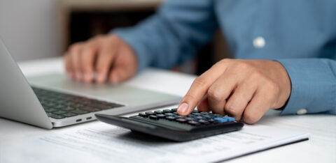 Modern business accounting management: Using technology for efficient tax calculations, accounting, assets, balance sheets, stock market statistics, and annual tax laws to protect businesses.