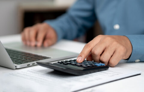 Modern business accounting management: Using technology for efficient tax calculations, accounting, assets, balance sheets, stock market statistics, and annual tax laws to protect businesses.