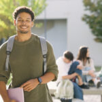 Young student smiling on university campus
