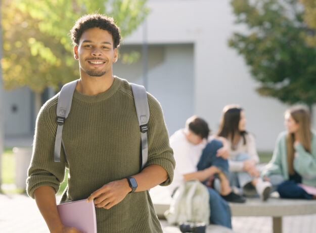 Young student smiling on university campus
