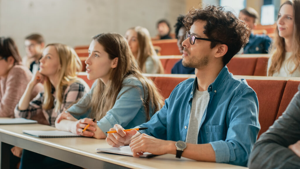 In the Classroom Multi Ethnic Students Listening to a Lecturer a