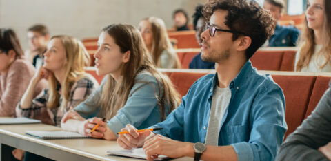 In the Classroom Multi Ethnic Students Listening to a Lecturer a