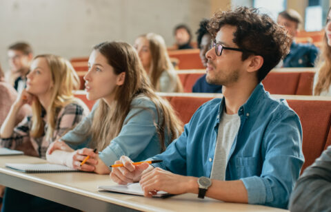 In the Classroom Multi Ethnic Students Listening to a Lecturer a