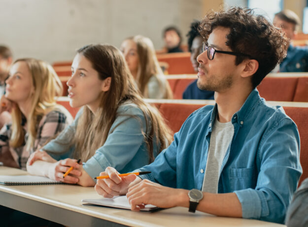 In the Classroom Multi Ethnic Students Listening to a Lecturer a