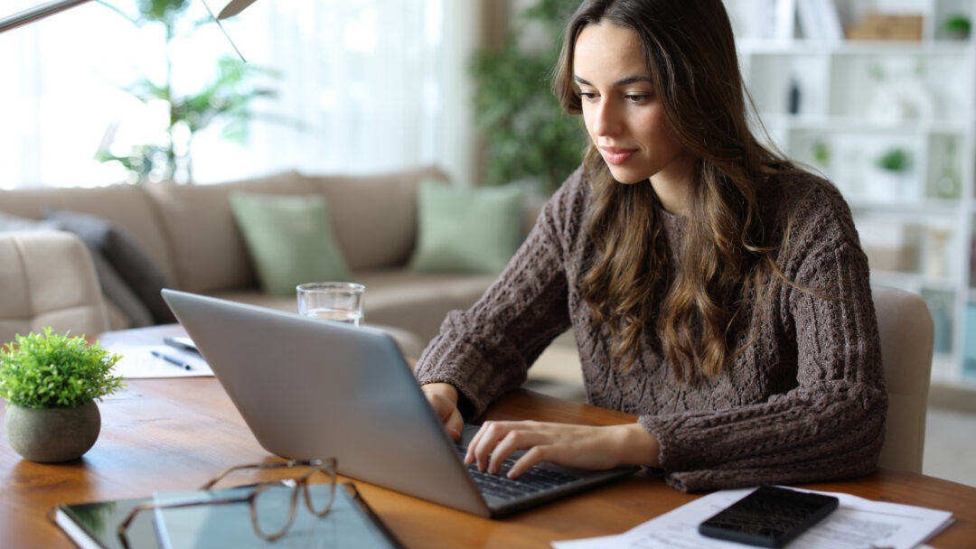 Tele worker working online at home using laptop