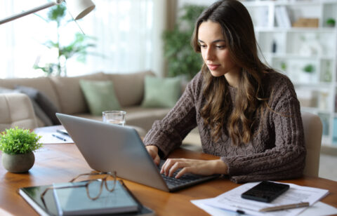 Tele worker working online at home using laptop